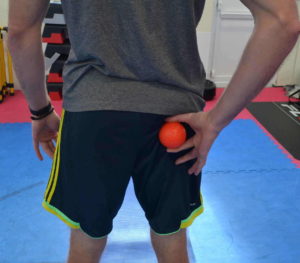 Location of trigger point for piriformis syndrome which can lead to buttock pain. Use this position to relieve buttock pain and bum muscle pain.