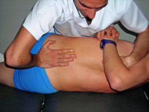 discussion about whether spinal manipulation can help with back pain and sciatica pain relief.