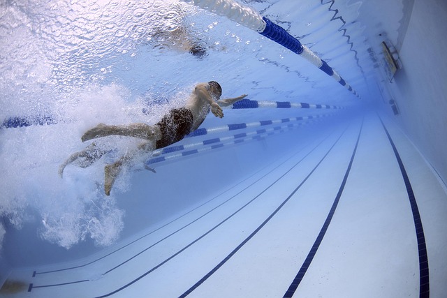 image of a man swimming which might be a better exercise for sciatica pain